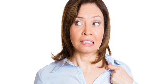 mature business woman opening shirt to vent, its hot, unpleasant, awkward situation-img-blog